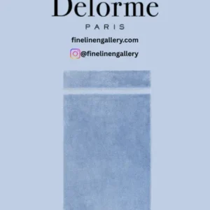 Soft white Yves Delorme Etoile bath towel made from plush, absorbent bath linen fabric, displayed folded on a neutral background.