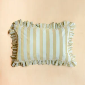 Single Pair of Cotton Pillowcases in Mint Stripe by TBCo with ruffled edge on pale wood background