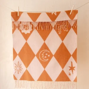TBCo Lambswool Baby Blanket in Harlequin Jacquard with rose pink and pumpkin orange diamond design and fringes