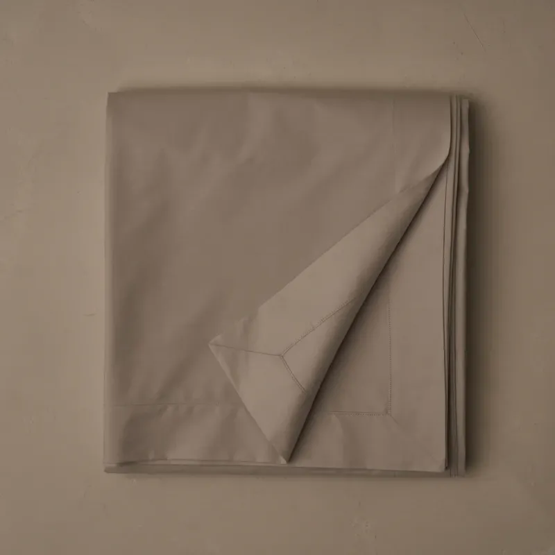 LETTO Retiring Classic Percale flat sheet folded in taupe.