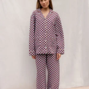 Model wearing TBCo Cotton Pyjamas in Blue Checkerboard with contrasting piping and elastic waistband.