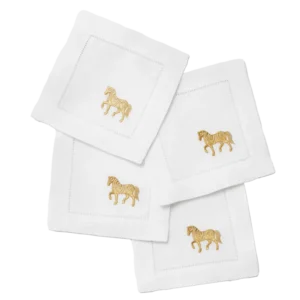 Sferra Year of the Horse white linen cocktail napkins with gold embroidered horse motif.