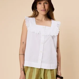 Model wearing TBCo Cotton Broderie Sleeveless Top in White with breathable natural and recycled fibres, Certified B-Corp, Women-Founded, designed to make an impact