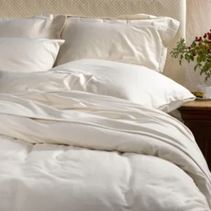 SDH The Purists Flannel duvet cover in ivory on a made bed with matching pillows.